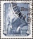A postage stamp from Germany, GDR showing the painting Ã¢â¬ÅA Young Standard BearerÃ¢â¬Â by Giovanni Battista